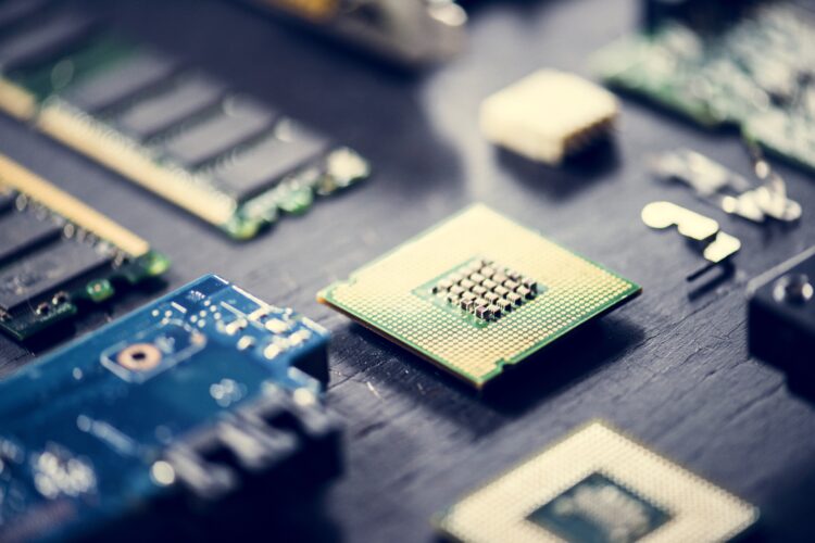 Close-up of computer components being processed for refurbishment